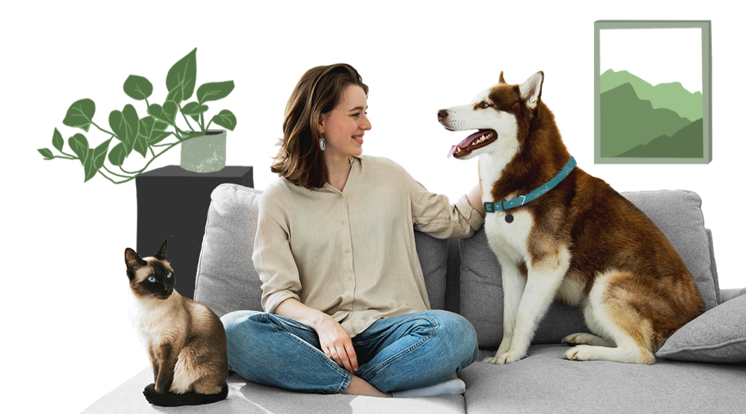 Woman sitting on couch with her dog and cat.